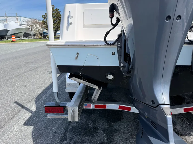 Slide: The Image of Contender 25 Tournament 2021 on trailer, rear view with outboard motor. - 29