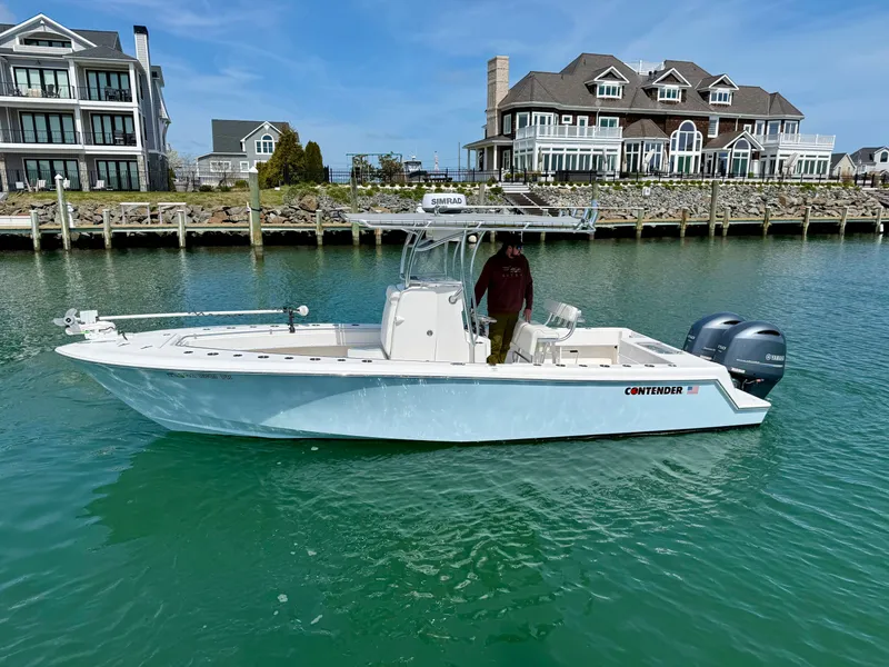 Slide: The Image of 2021 Contender 25 Tournament boat near waterfront homes. - 3