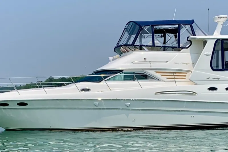 The Image of Sea Ray 420 Aft Cabin yacht, 2000 model, cruising on calm waters. - 0