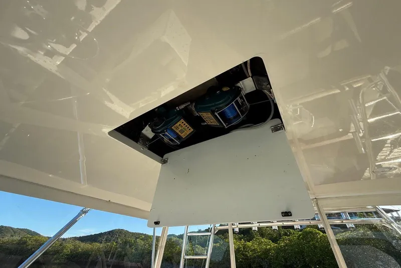 Slide: The Image of Ceiling view of 2003 Cabo 35 Express boat with electronic components exposed. - 16