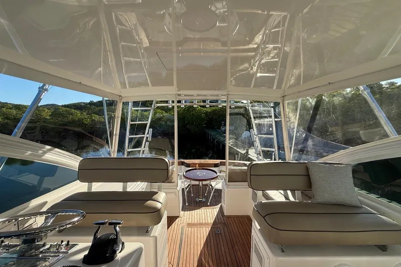 Slide: The Image of Interior view of 2003 Cabo 35 Express yacht with seating and helm. - 20
