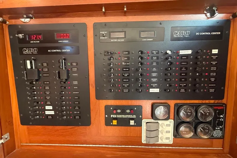 Slide: The Image of Electrical control panel of a 2003 Cabo 35 Express yacht, featuring AC and DC systems. - 22