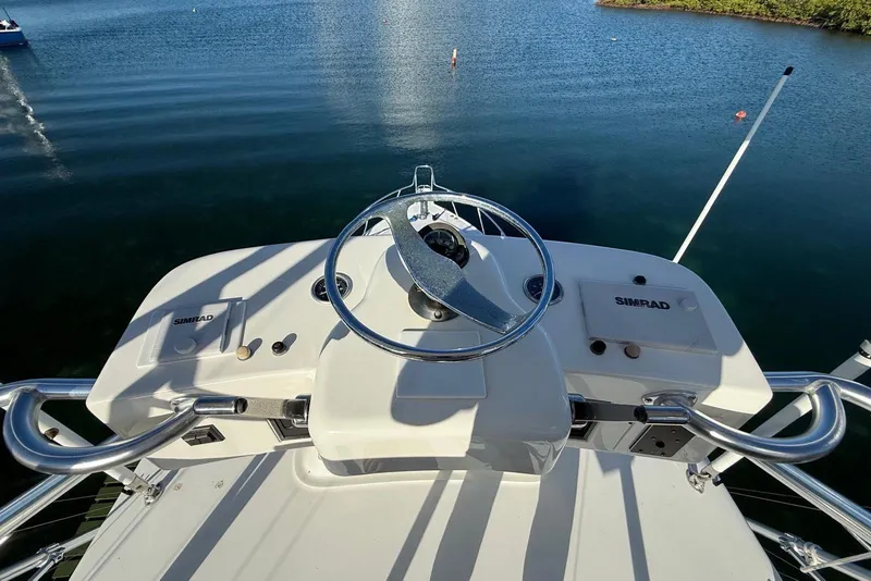 Slide: The Image of Helm of 2003 Cabo 35 Express boat with Simrad navigation system. - 35