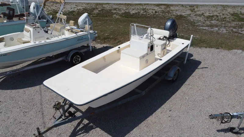 The Image of 2000 Jones Brothers Bateau boat on trailer, side view. - 1
