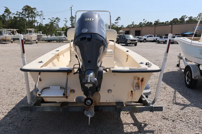 Slide: The Image of Rear view of a 2000 Jones Brothers Bateau with outboard motor. - 16