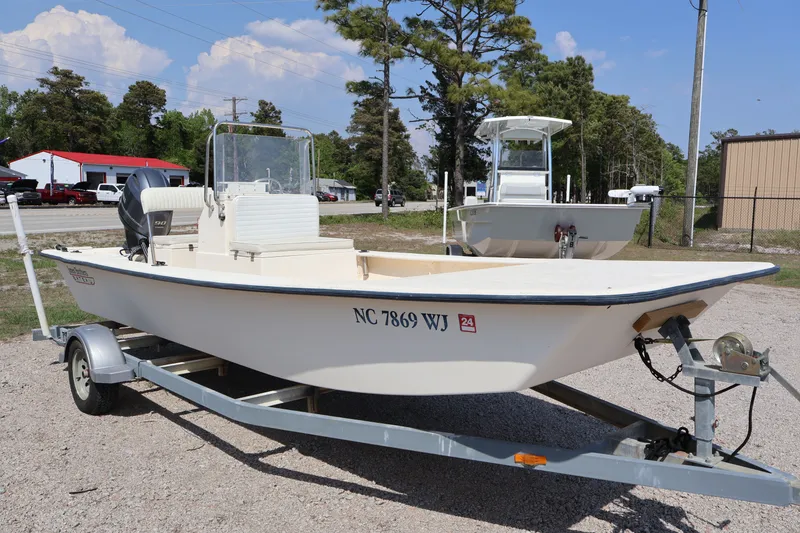 Slide: The Image of 2000 Jones Brothers Bateau on trailer, parked outdoors. - 17