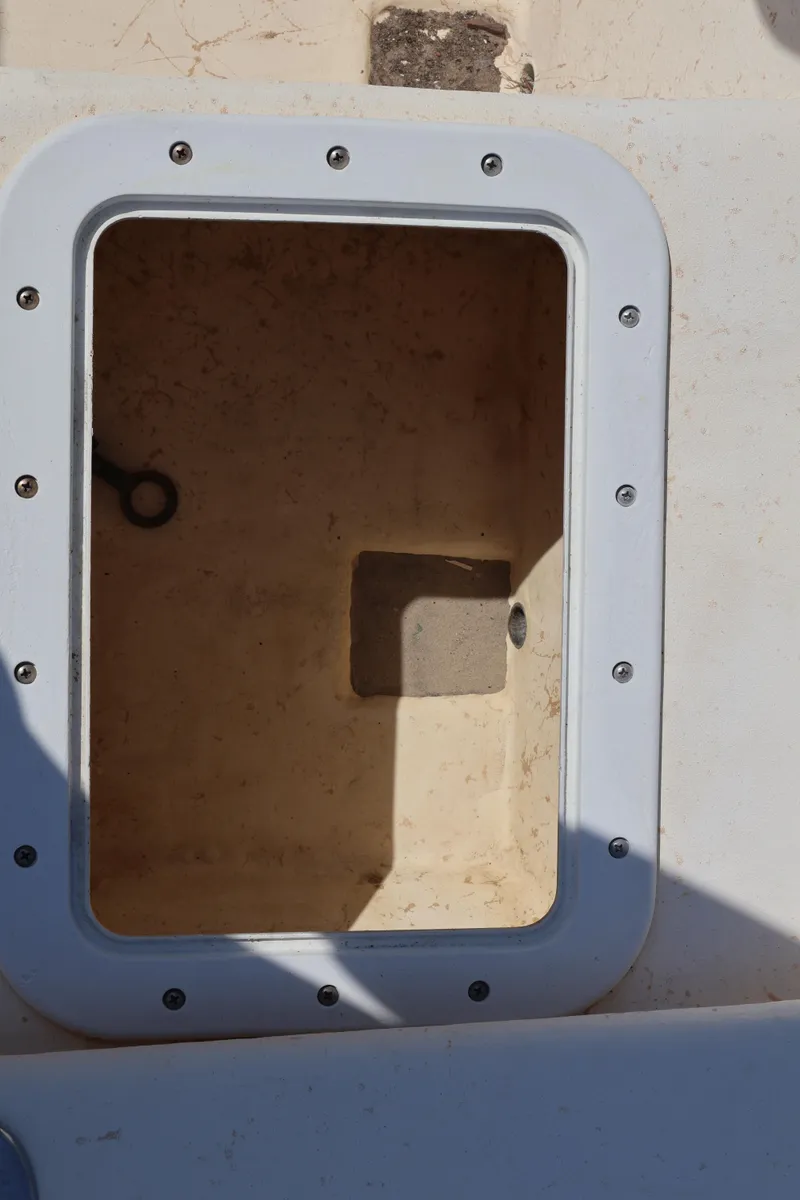 Slide: The Image of Open storage compartment on a 2000 Jones Brothers Bateau boat. - 9