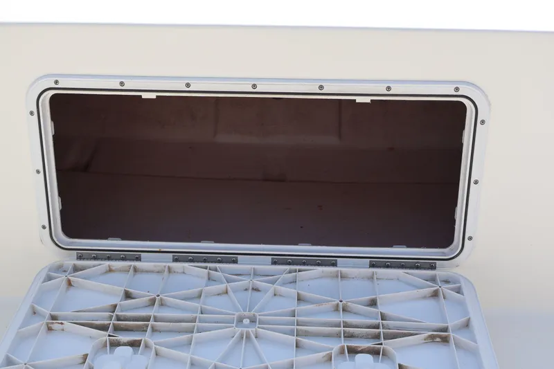 Slide: The Image of Open storage compartment on a 2020 KenCraft F2460 BAY RIDER boat. - 10