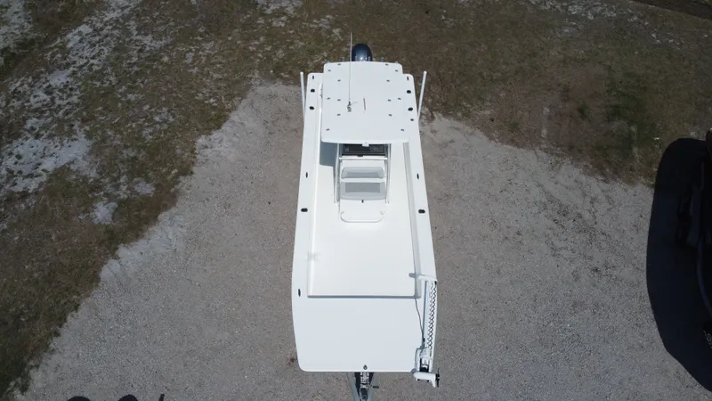 Slide: The Image of Aerial view of a 2020 KenCraft F2460 BAY RIDER boat on dry land. - 12