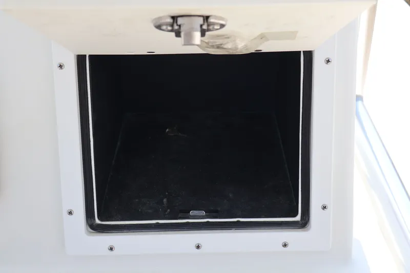 Slide: The Image of Open storage compartment on a 2020 KenCraft F2460 BAY RIDER boat. - 19
