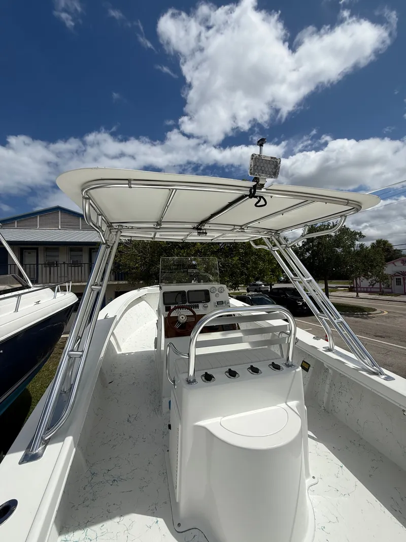 Slide: The Image of 2021 C-Hawk Center Console 29 boat under blue sky. - 11