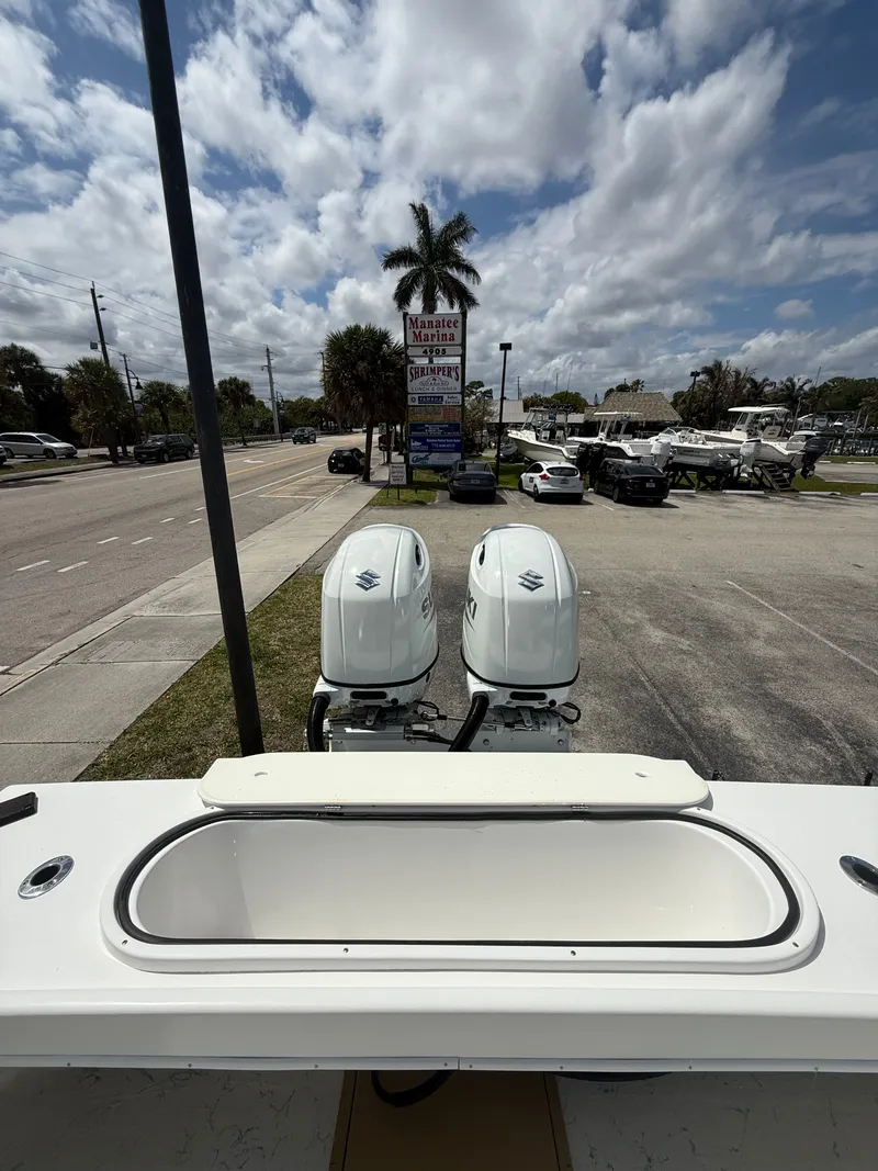 Slide: The Image of C-Hawk Center Console 29 boat with twin outboard engines, 2021 model. - 16