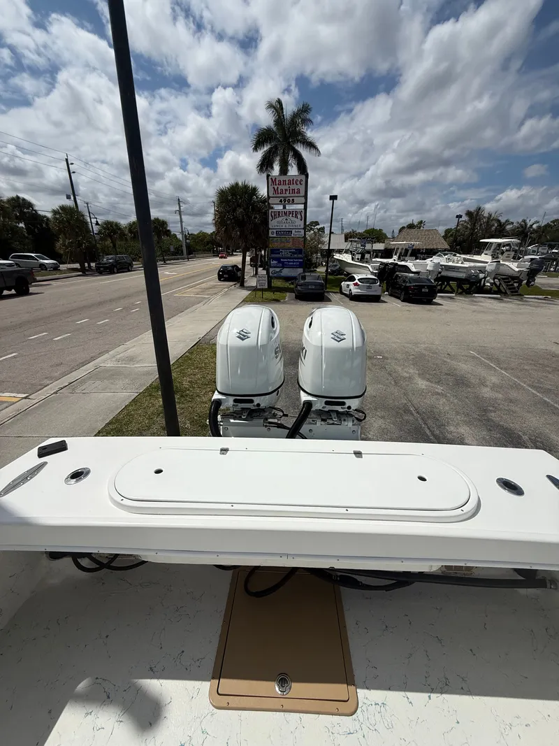 Slide: The Image of C-Hawk Center Console 29 boat with twin outboard engines, 2021 model. - 17