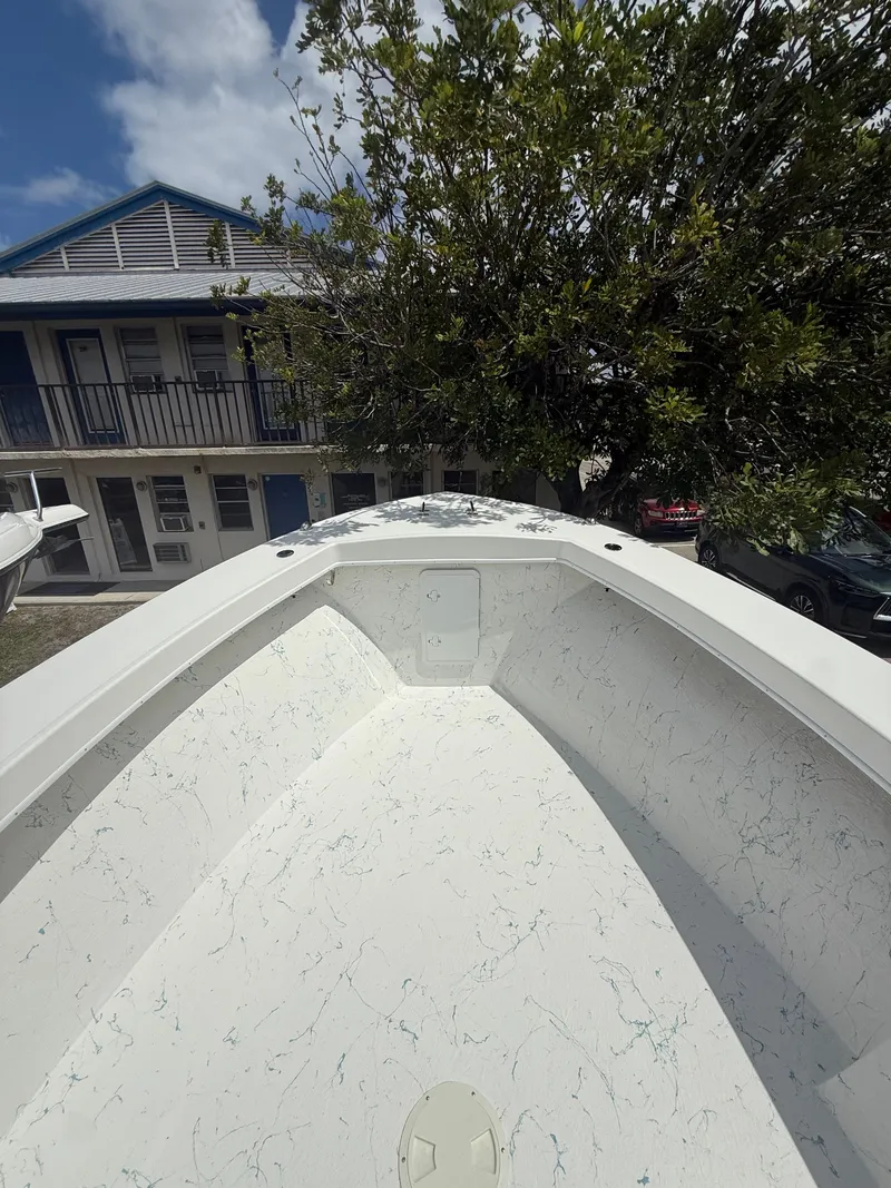 Slide: The Image of 2021 C-Hawk Center Console 29 boat, front view outdoors. - 2