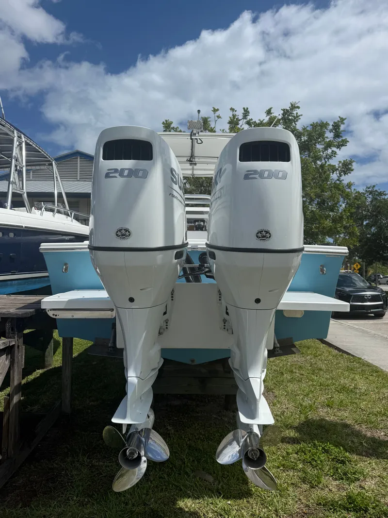 Slide: The Image of 2021 C-Hawk Center Console 29 with dual outboard engines. - 20