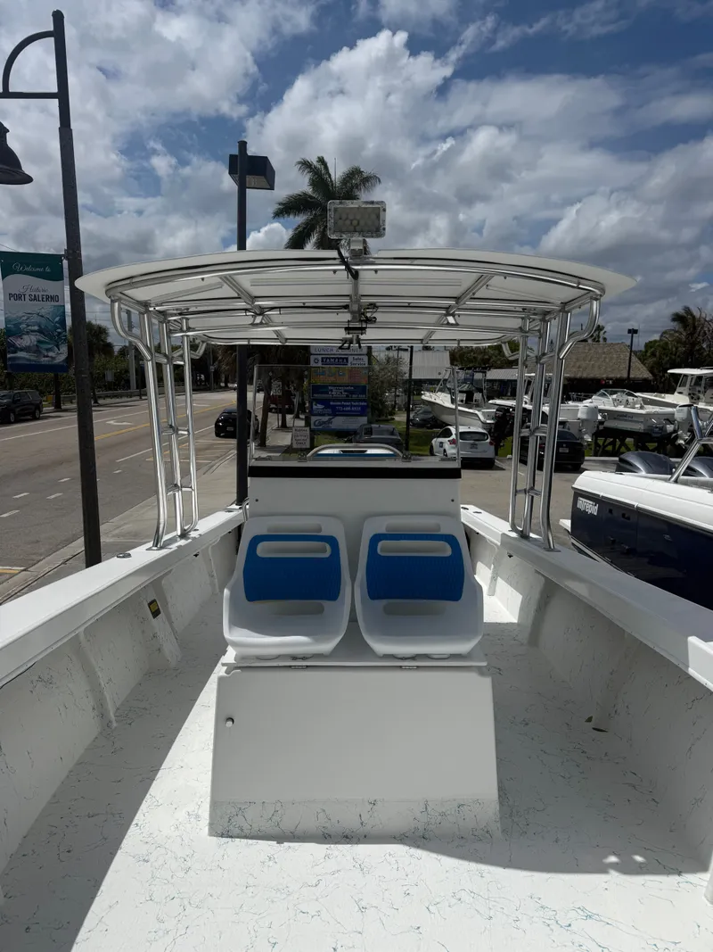 Slide: The Image of 2021 C-Hawk Center Console 29 boat with blue seats. - 3