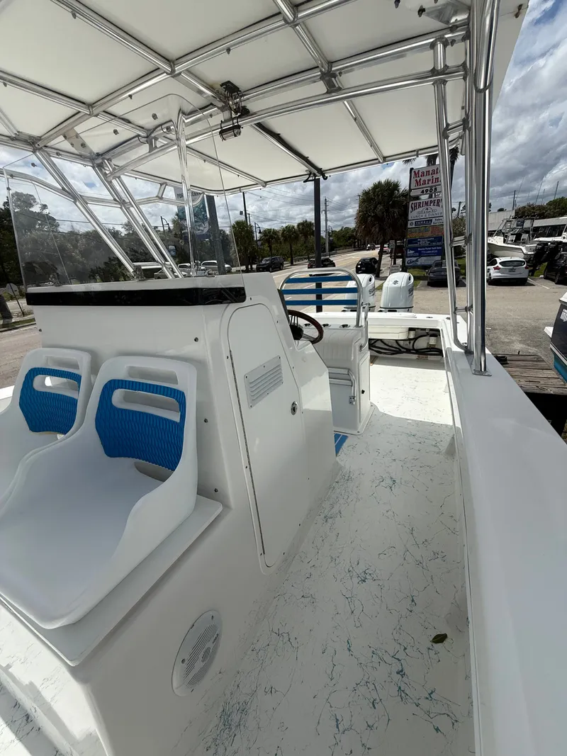 Slide: The Image of 2021 C-Hawk Center Console 29 boat with blue and white seating. - 4