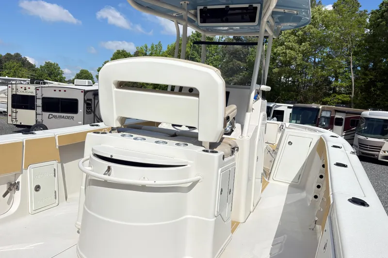 Slide: The Image of 2017 Carolina Skiff Sea Chaser 27 HFC boat interior with seating and storage compartments. - 11