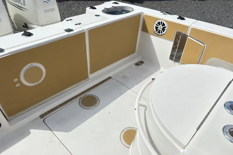 Slide: The Image of 2017 Carolina Skiff Sea Chaser 27 HFC boat interior with tan and white design. - 14