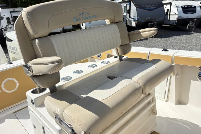 Slide: The Image of 2017 Carolina Skiff Sea Chaser 27 HFC boat seating with armrests and cup holders. - 17