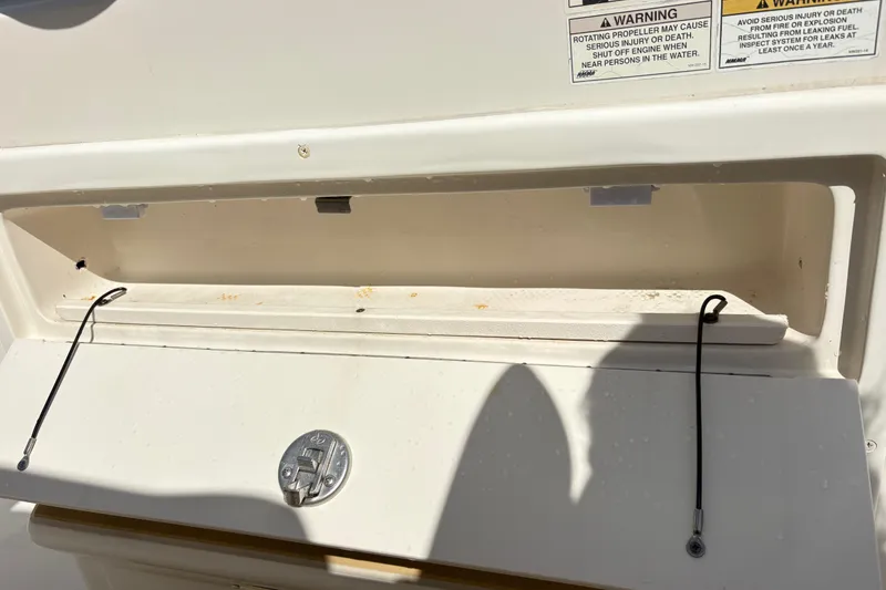 Slide: The Image of Open storage compartment on a 2017 Carolina Skiff Sea Chaser 27 HFC boat. - 19