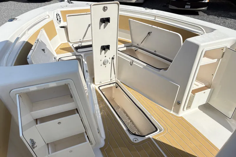 Slide: The Image of 2017 Carolina Skiff Sea Chaser 27 HFC boat interior with open storage compartments. - 23