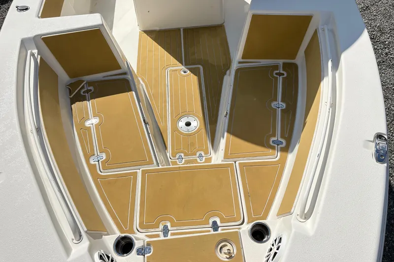 Slide: The Image of 2017 Carolina Skiff Sea Chaser 27 HFC boat deck with tan and white detailing. - 24