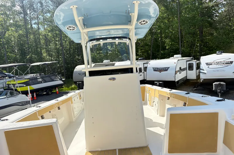 Slide: The Image of 2017 Carolina Skiff Sea Chaser 27 HFC boat in storage lot with RVs. - 25