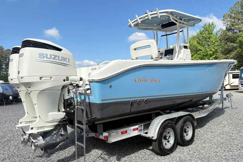 Slide: The Image of 2017 Carolina Skiff Sea Chaser 27 HFC boat with Suzuki engines on trailer. - 7