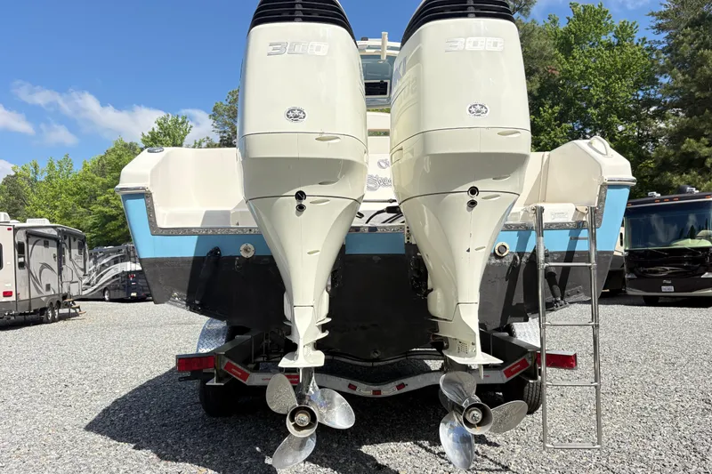 Slide: The Image of 2017 Carolina Skiff Sea Chaser 27 HFC with dual outboard motors on trailer. - 9
