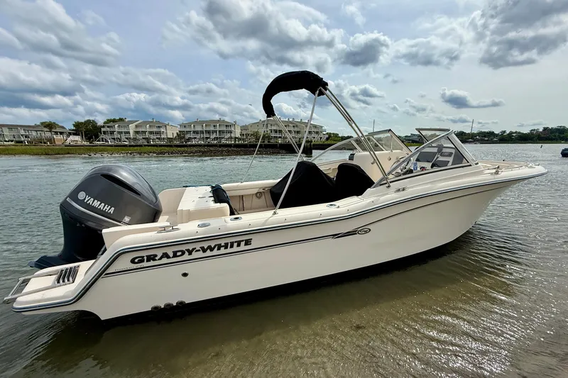 Slide: The Image of 2017 Grady-White Freedom 235 boat with Yamaha engine on calm water. - 10