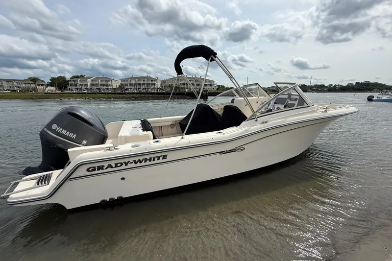 Slide: The Image of 2017 Grady-White Freedom 235 boat with Yamaha engine on calm water. - 13