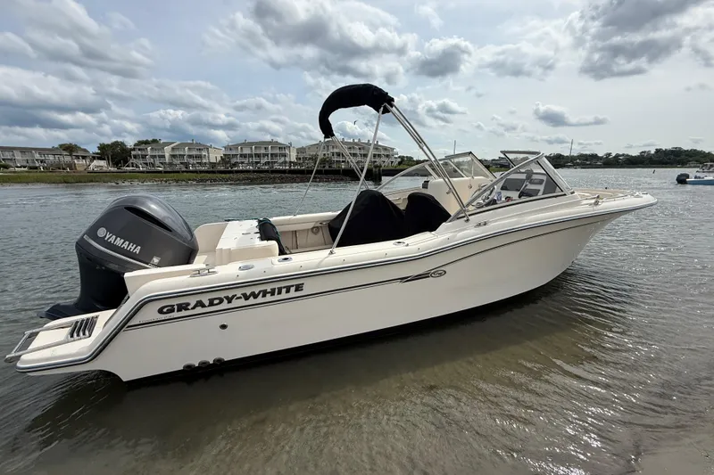 Slide: The Image of 2017 Grady-White Freedom 235 boat with Yamaha engine on calm water. - 14