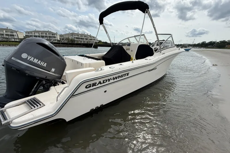 Slide: The Image of 2017 Grady-White Freedom 235 boat with Yamaha engine on sandy shore. - 18