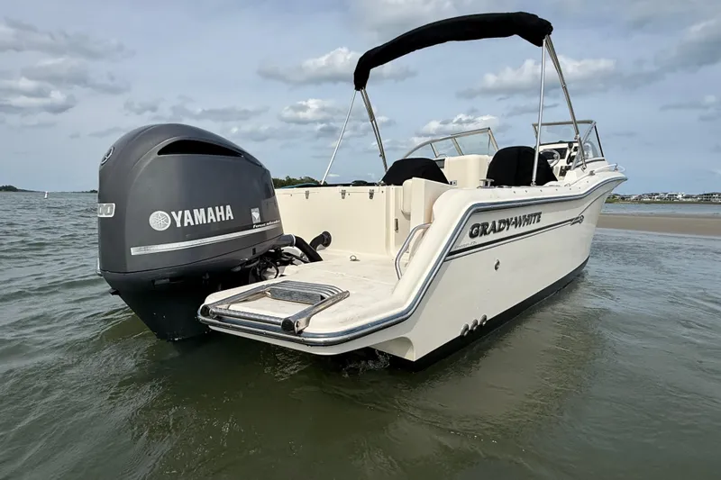 Slide: The Image of 2017 Grady-White Freedom 235 boat with Yamaha engine on calm water. - 26