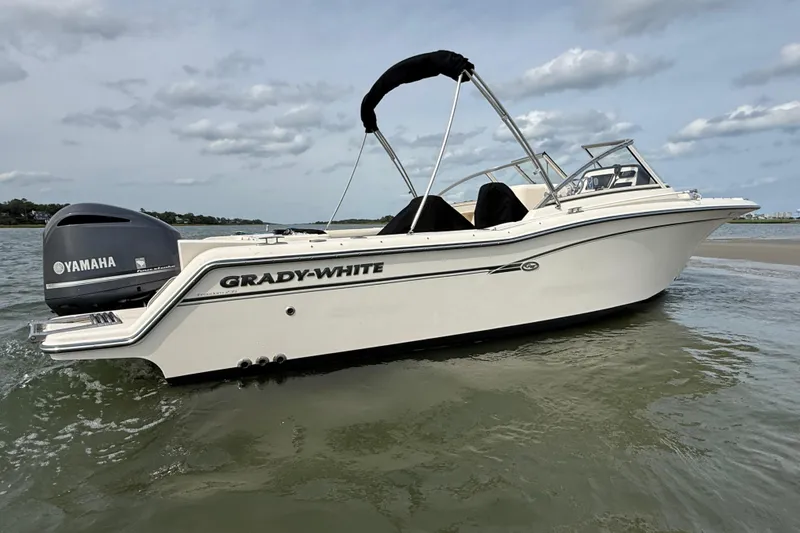 Slide: The Image of 2017 Grady-White Freedom 235 boat with Yamaha engine on calm water. - 27