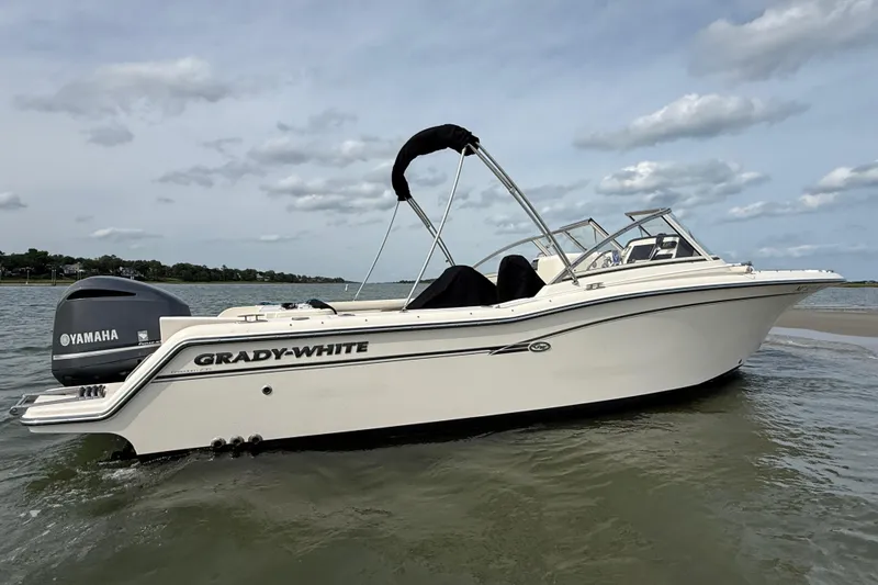 Slide: The Image of 2017 Grady-White Freedom 235 boat with Yamaha engine on calm water. - 28
