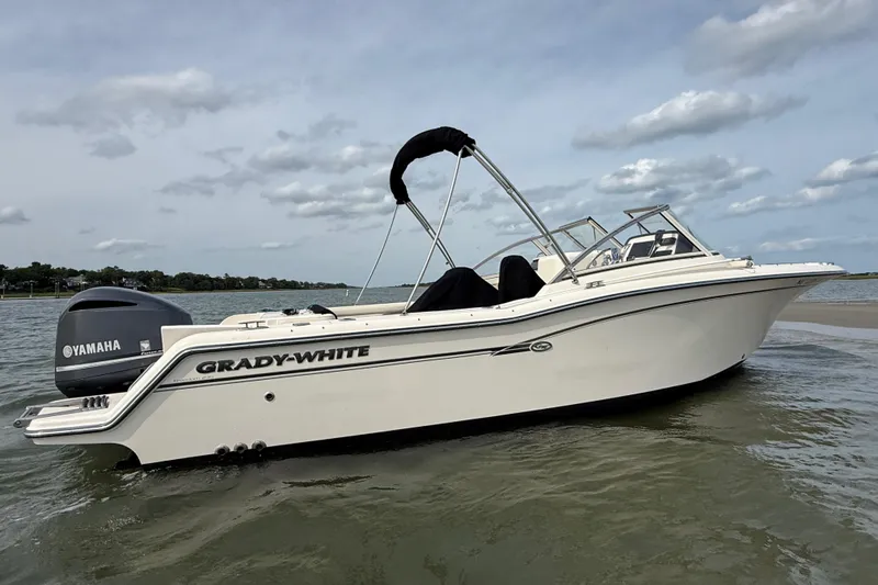 Slide: The Image of 2017 Grady-White Freedom 235 boat with Yamaha engine on calm water. - 29