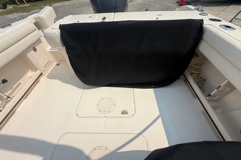 Slide: The Image of 2017 Grady-White Freedom 235 boat interior with seating and storage compartments. - 31