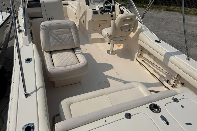 Slide: The Image of 2017 Grady-White Freedom 235 boat interior with seating and steering console. - 32