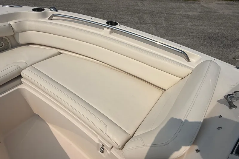 Slide: The Image of 2017 Grady-White Freedom 235 boat interior with white cushioned seating. - 41