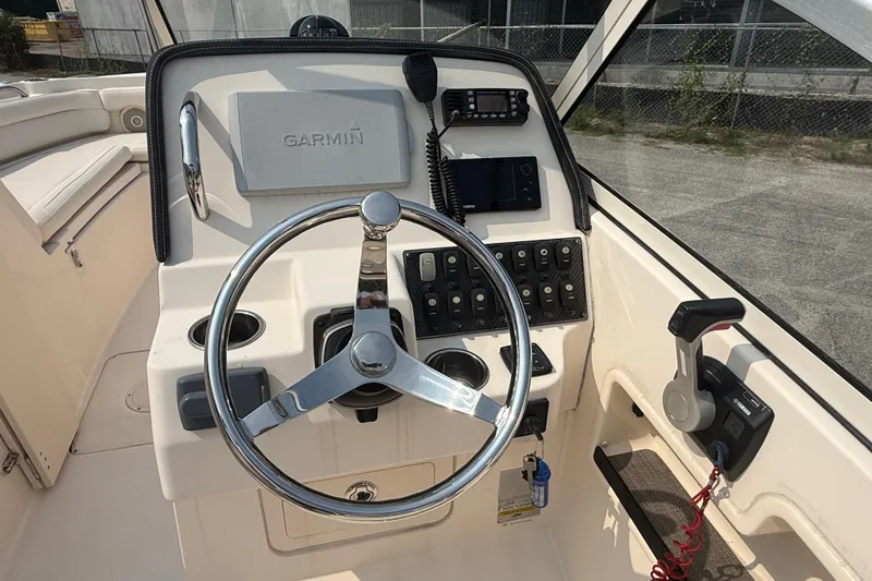 Slide: The Image of 2017 Grady-White Freedom 235 boat helm with Garmin navigation and Yamaha controls. - 45