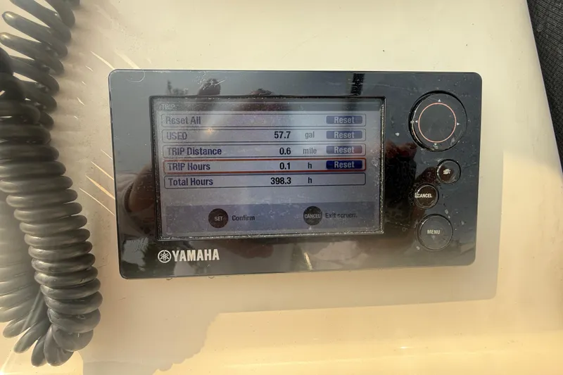 Slide: The Image of Yamaha display on 2017 Grady-White Freedom 235 showing trip data and fuel usage. - 56