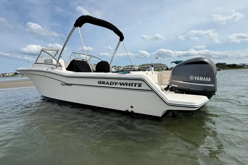 Slide: The Image of 2017 Grady-White Freedom 235 boat with Yamaha engine on calm water. - 9