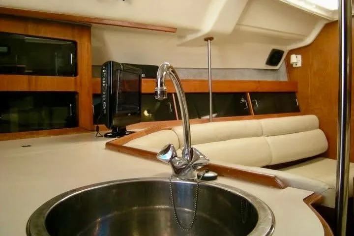 Slide: The Image of Interior of 1987 Hunter Legend 35 yacht with sink and seating area. - 12