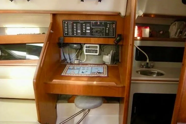 Slide: The Image of Interior of 1987 Hunter Legend 35 sailboat with navigation station and galley area. - 13