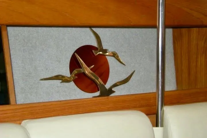 Slide: The Image of Decorative interior of 1987 Hunter Legend 35 yacht with bird sculpture and red circle. - 14