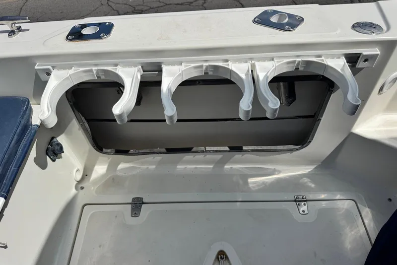 Slide: The Image of Rod holders on a 1991 Boston Whaler 21 Conquest R boat deck. - 16