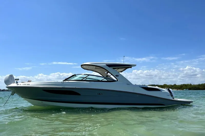 The Image of 2016 Sea Ray SLX 350 boat on clear water under a blue sky. - 0