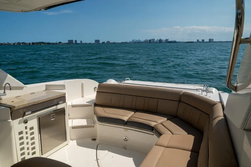 Slide: The Image of Luxurious 2016 Sea Ray SLX 350 boat interior with ocean view and city skyline. - 13